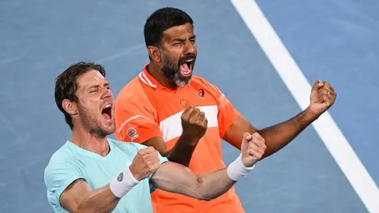 Rohan Bopanna (R) and Australia's Matthew Ebden celebrate after victory against Italy's Simone Bolelli and Andrea Vavassori during their men's doubles final match on day 14 of the Australian Open tennis tournament in Melbourne on January 27, 2024(AFP)