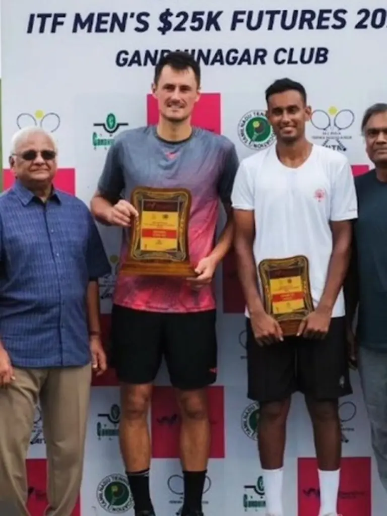 Tomic with his trophy.