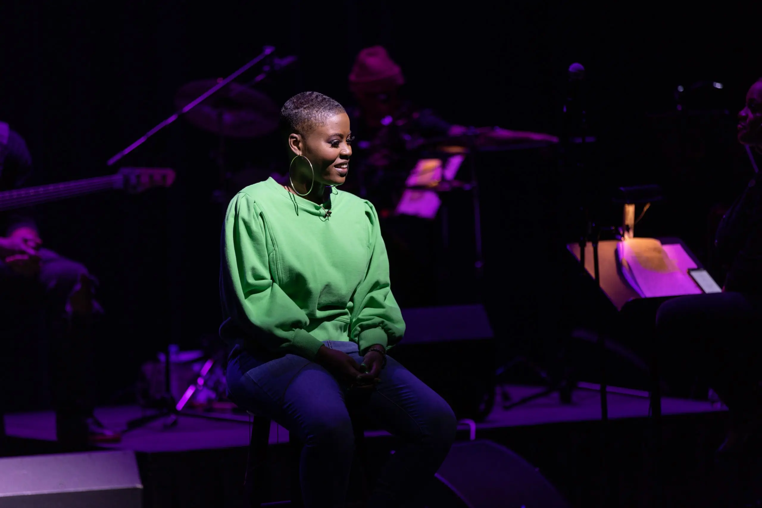 Mia Love Live on stage performing her one-woman show about navigating anxiety and life as a Black woman.