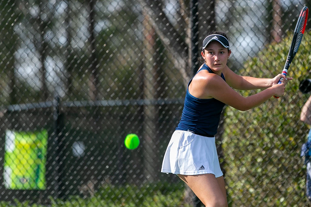 Woman swinging a tennis racket