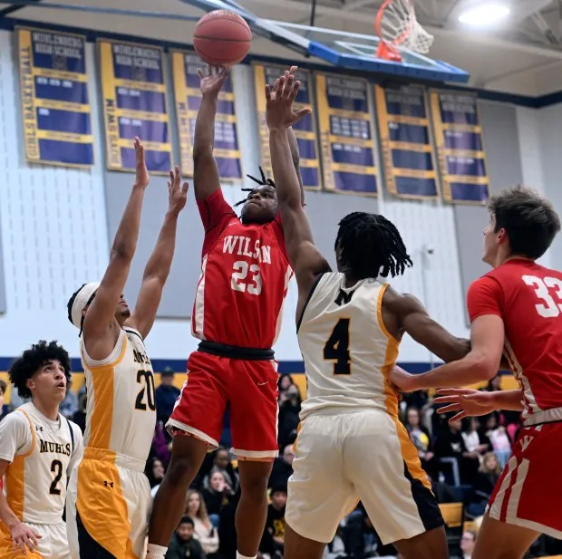 Wilson's Correll Akings takes a shot in the lane against Muhlenberg on Monday in Laureldale. (BILL UHRICH - READING EAGLE)