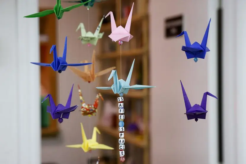 Origami cranes hang from the ceiling at The Art Room, a nonprofit art studio, Monday, Jan....