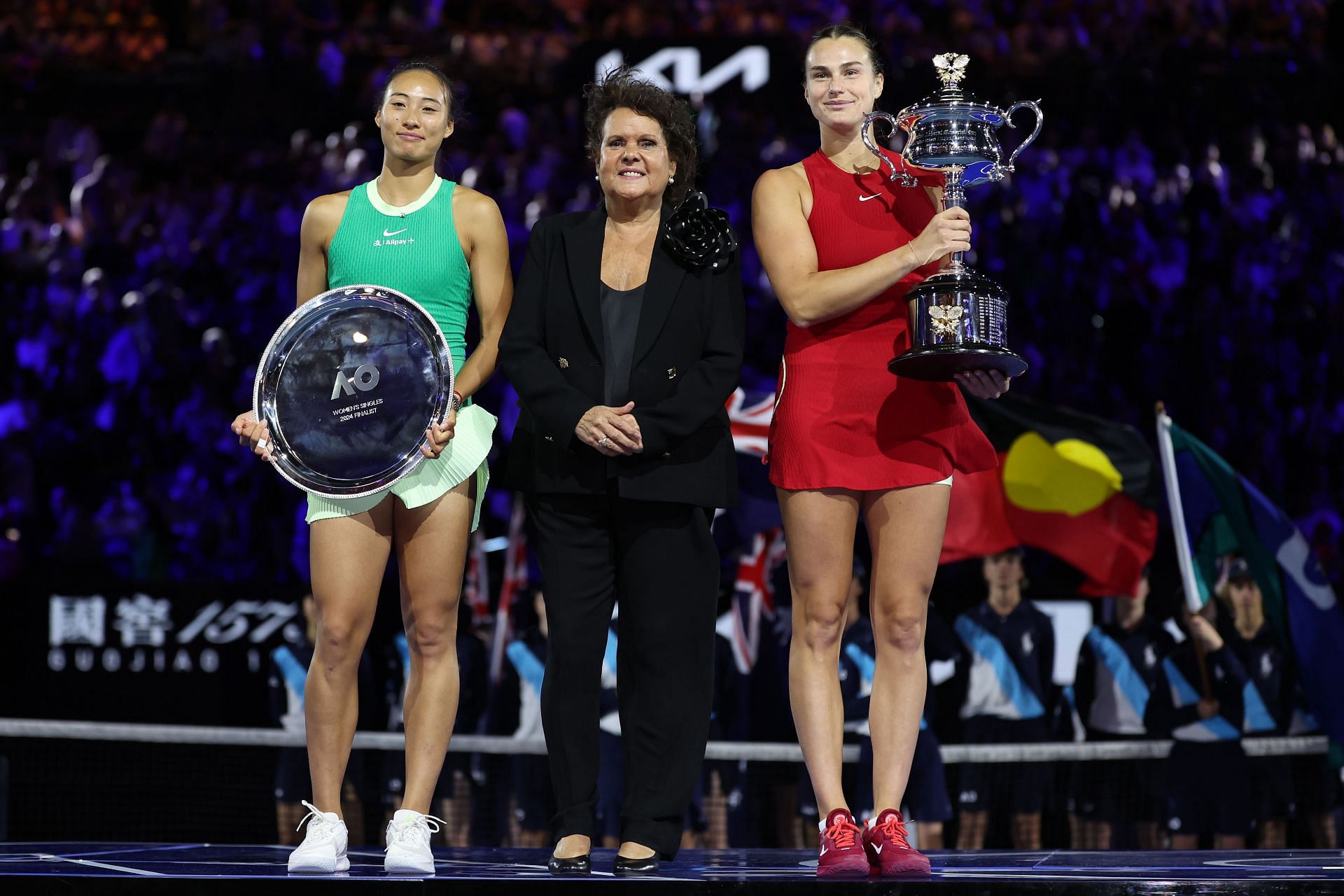 Zheng Qinwen poses with Australian Open 2024 runner-up trophy wearing a $2850 dress