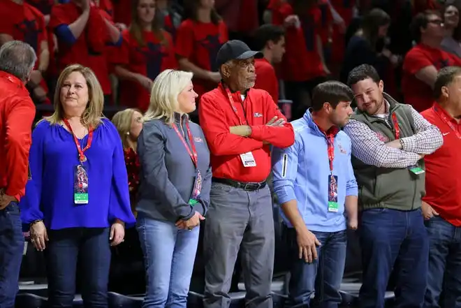 Jan 30, 2018; Oxford, MS, USA; Movie actor Morgan Freeman (middle) looks on during a game between the Mississippi Rebels and the Auburn Tigers at The Pavilion at Ole Miss. Mandatory Credit: Spruce Derden-USA TODAY Sports