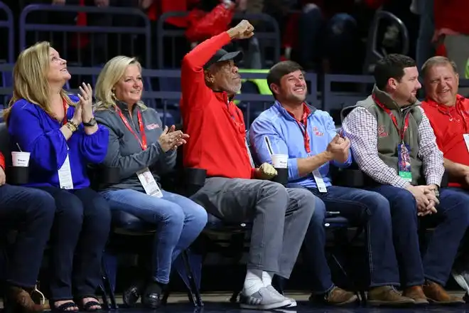 Jan 30, 2018; Oxford, MS, USA; Actor Morgan Freeman throws up a fist pump to get the crowd louder during the second half between the Mississippi Rebels and the Auburn Tigers at The Pavilion at Ole Miss. Auburn Tigers defeat the Mississippi Rebels 79-70. Mandatory Credit: Spruce Derden-USA TODAY Sports