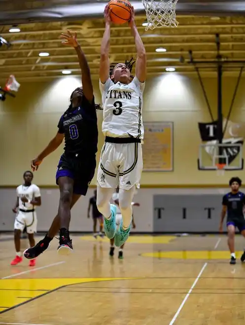 Treasure Coast's Tyson Wilson (3) attempts a dunk in a boys high school basketball game against Okeechobee, Tuesday, Jan. 30, 2024, in Port St. Lucie.