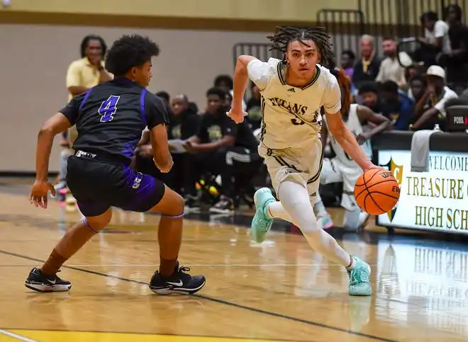 Treasure Coast's Tyson Wilson (3) drives to the basket in a boys high school basketball game against Okeechobee, Tuesday, Jan. 30, 2024, in Port St. Lucie.