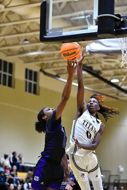 Treasure Coast's Bek Fleurissaint (0) blocks the shot of Okeechobee’s Chaynaya’ah Phillips (0) in a boys high school basketball game, Tuesday, Jan. 30, 2024, in Port St Lucie.