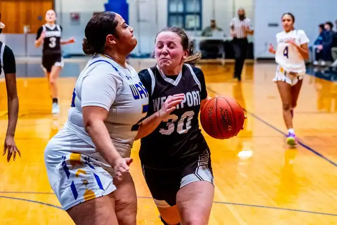 Westport's Sarah Perry powers her way to the basket.