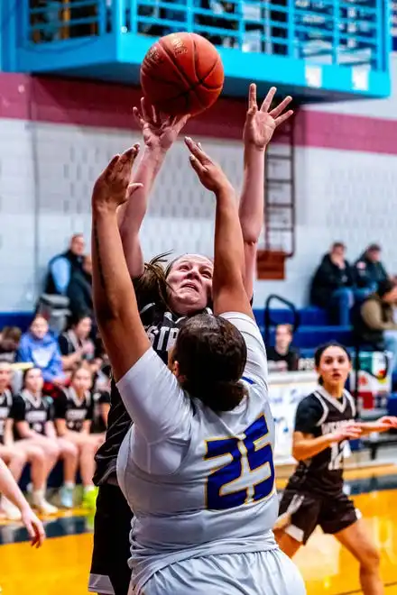 Westport's Sarah Perry powers her way to the basket.