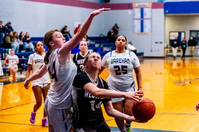 Westport's Skylar Rezendes draws the foul.