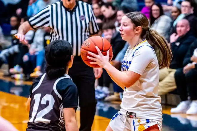 Wareham's Jordyn Elwood moves the ball cross court.