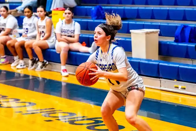 Wareham's Carly Glover focues on the basket.