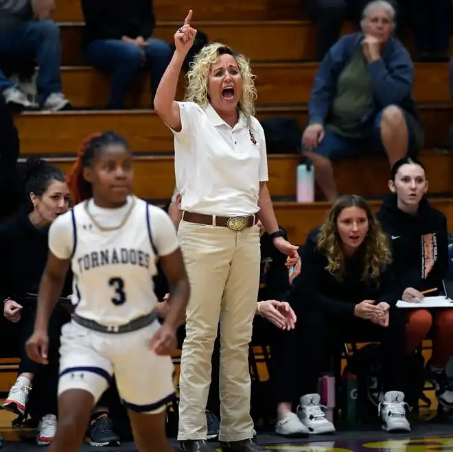 The area varsity girls basketball teams will end their regular season as Booker will host IMG Academy Blue Wed. Jan. 31, 2024, 7p.m. at Booker's Tornado Alley and the Sarasota Sailors will host the Cardinal Mooney Cougars at 6:00 p.m. on Friday Feb. 2, 2024, at Sarasota's Edward F. Howell Gymnasium. Sarasota's head coach Radhika Miller barking orders during the game. Here action between Booker and Sarasota. Booker took a two point lead in the last 38.4 seconds of remaining regulation play winning 56-54 on Thursday night Jan. 18, 2024, at Booker's Tornado Alley in Sarasota.