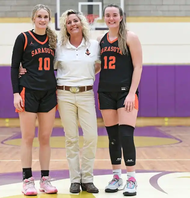 Sarasota's Kennedy McClain (#10), Sarasota's head coach Radhika Miller and her daughter Sofi Miller (#12).