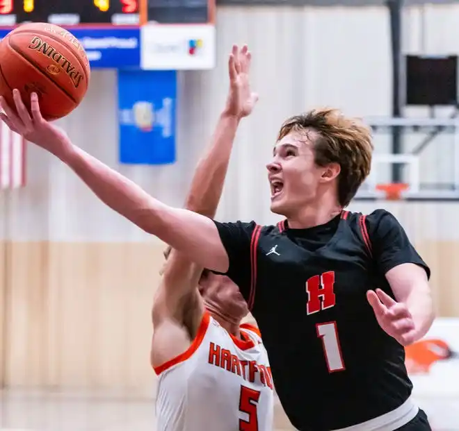 Homestead's Tommy O'Hagan (1) drives in for a layup at Hartford, Tuesday, Jan. 30, 2024.