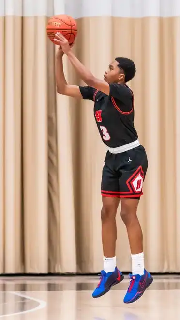 Homestead's Michael Rogers Jr. (3) tries for three during the game at Hartford, Tuesday, Jan. 30, 2024. Homestead won 93-66.