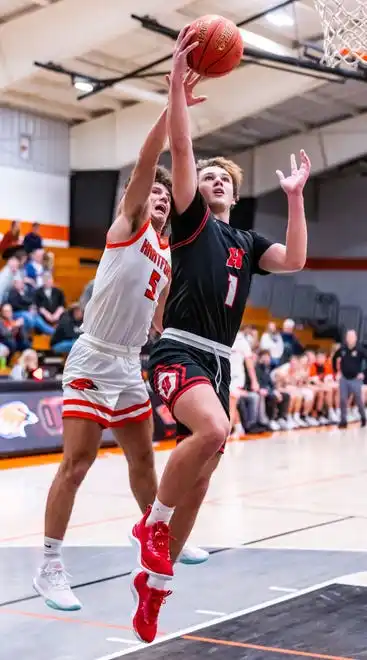 Homestead's Tommy O'Hagan (1) drives in for a layup at Hartford, Tuesday, Jan. 30, 2024.