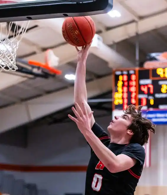 Homestead's Liam Riese (0) elevates for two during the game at Hartford, Tuesday, Jan. 30, 2024.