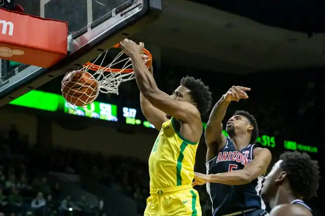 Oregon guard Kario Oquendo dunks the ball as the Oregon Ducks host the Arizona Wildcats Saturday, Jan. 27, 2024 at Matthew Knight Arena in Eugene, Ore.