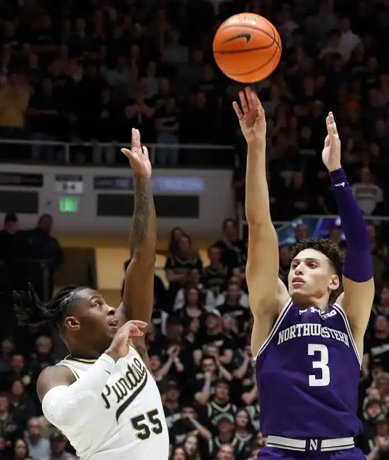 Purdue Boilermakers guard Lance Jones (55) defends the shot of Northwestern Wildcats guard Ty Berry (3) during the NCAA men’s basketball game, Wednesday, Jan. 31, 2024, at Mackey Arena in West Lafayette, Ind.