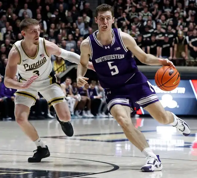 Purdue Boilermakers guard Braden Smith (3) defends Northwestern Wildcats guard Ryan Langborg (5) during the NCAA men’s basketball game, Wednesday, Jan. 31, 2024, at Mackey Arena in West Lafayette, Ind.