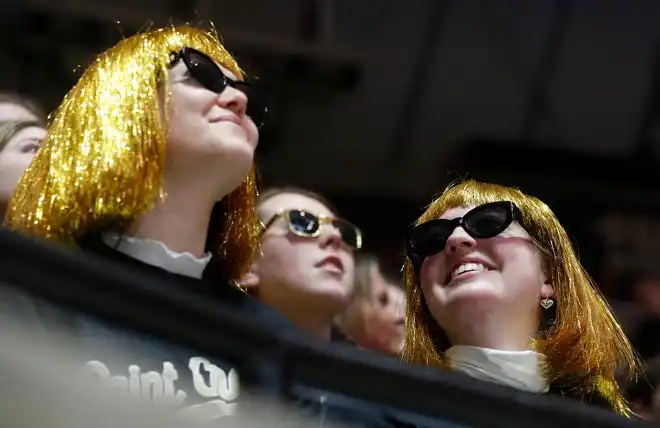 Purdue Boilermakers fans wear matching wigs during the NCAA men’s basketball game against the Northwestern Wildcats, Wednesday, Jan. 31, 2024, at Mackey Arena in West Lafayette, Ind.