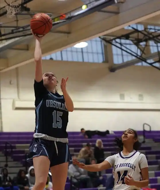 Ursuline's Anne Keneally (15) drives to the basket during their 78-23 win over New Rochelle in girls basketball action at New Rochelle High School on Wednesday, Jan. 31, 2024.Keenally had 10 points in the game.