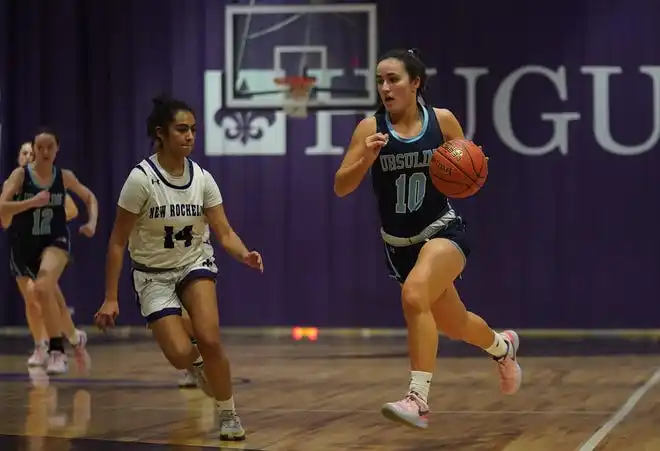 Ursuline's Sophia Nascimento (10) works past New Rochelle Jocelyn Hernandez (14) during their 78-23 win in girls basketball action at New Rochelle High School on Wednesday, Jan. 31, 2024. Nascimento had 16 points in the game.