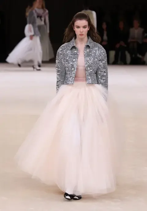 Getty / Pascal Le Segretain Alice McGrath walking for Chanel couture