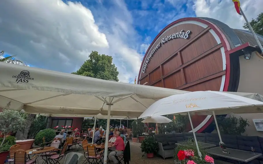 The outside beer garden patio in the shade of the Dürkheim Giant Barrel in Bad Dürkheim, Germany, June 6, 2022. The outside area offers seating for up to 210 guests during Germany's mild summer days. 