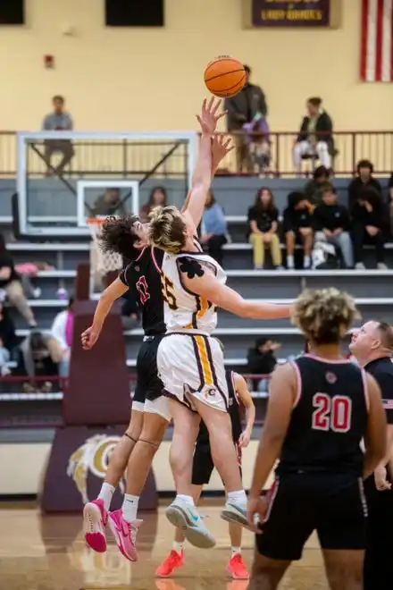 Andrews’ Cameron Rattler, left, and Cherokee’s Luke Smith reach for the jump ball, January 30, 2024.