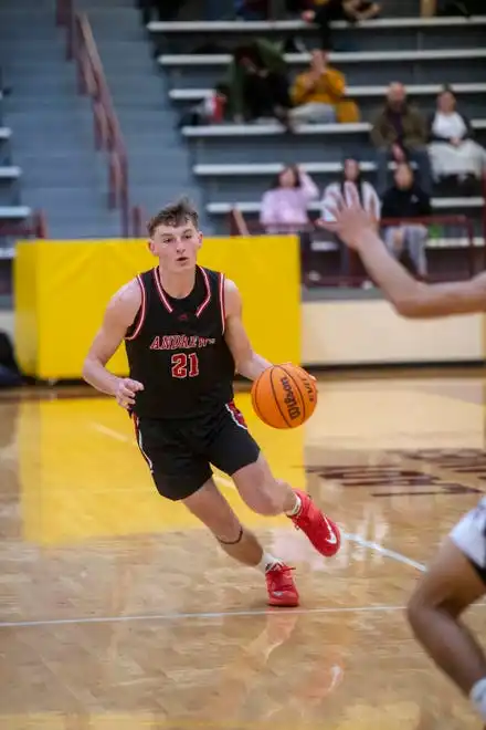 Andrews’ Ty Clark dribbles the ball in the game at Cherokee, January 30, 2024.