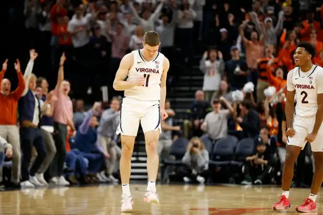 Jan 31, 2024; Charlottesville, Virginia, USA; Virginia Cavaliers guard Isaac McKneely (11) celebrates after scoring against the Notre Dame Fighting Irish during the first half at John Paul Jones Arena. Mandatory Credit: Amber Searls-USA TODAY Sports