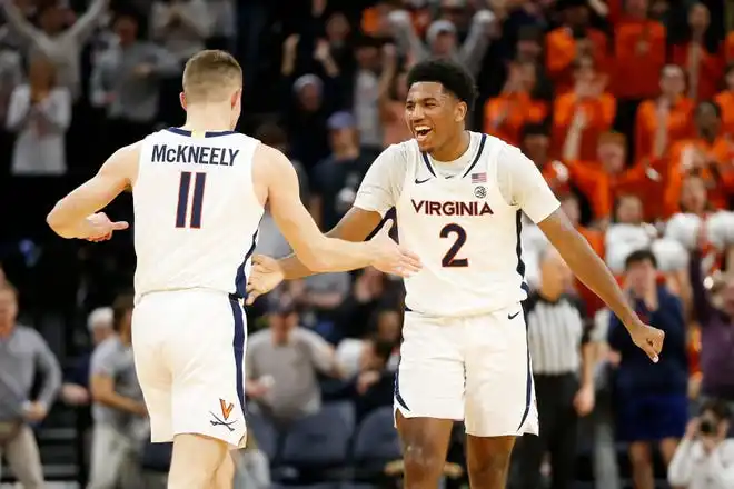 Jan 31, 2024; Charlottesville, Virginia, USA; Virginia Cavaliers guard Isaac McKneely (11) celebrates with Cavaliers guard Reece Beekman (2) after scoring against the Notre Dame Fighting Irish during the first half at John Paul Jones Arena. Mandatory Credit: Amber Searls-USA TODAY Sports