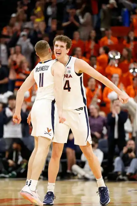 Jan 31, 2024; Charlottesville, Virginia, USA; Virginia Cavaliers guard Isaac McKneely (11) celebrates Cavaliers forward Jacob Groves (34) after scoring against the Notre Dame Fighting Irish during the first half at John Paul Jones Arena. Mandatory Credit: Amber Searls-USA TODAY Sports