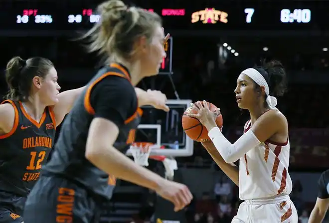 Iowa State Cyclones forward Jalynn Bristow (1) looks for a pass around Oklahoma State Cowgirls forward Lior Garzon (12) and guard Anna Gret Asi (4)during the first quarter in the Big-12 conference matchup at Hilton Coliseum on Wednesday, Jan. 31, 2024, in Ames, Iowa.