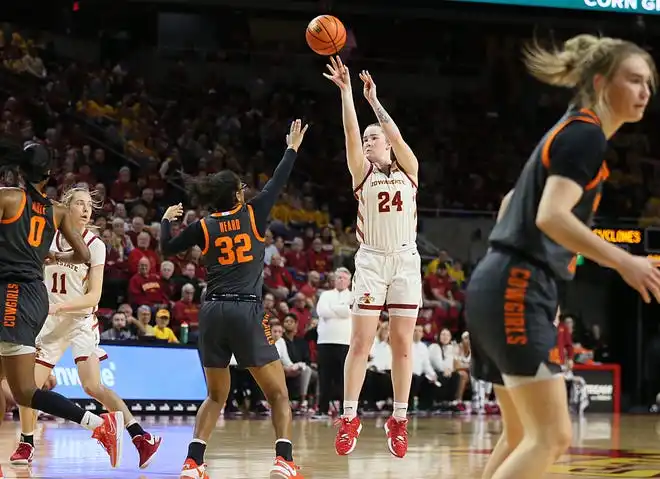 Iowa State Cyclones forward Addy Brown (24) xtakes a three-point shot over Oklahoma State Cowgirls guard Stailee Heard (32) during the first quarter in the Big-12 conference matchup at Hilton Coliseum on Wednesday, Jan. 31, 2024, in Ames, Iowa.