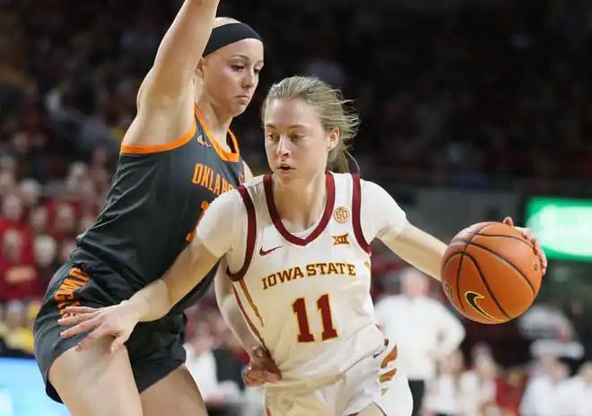 Iowa State Cyclones guard Emily Ryan (11) drives around Oklahoma State Cowgirls guard Rylee Langerman (11) during the second quarter in the Big-12 conference matchup at Hilton Coliseum on Wednesday, Jan. 31, 2024, in Ames, Iowa.