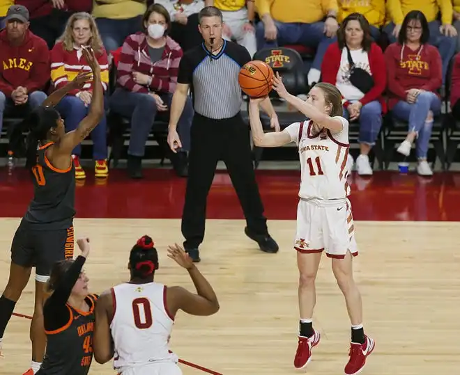 Iowa State Cyclones guard Emily Ryan (11) takes a three-point shot over Oklahoma State Cowgirls guard Quincy Noble (0)during the third quarter in the Big-12 conference matchup at Hilton Coliseum on Wednesday, Jan. 31, 2024, in Ames, Iowa.