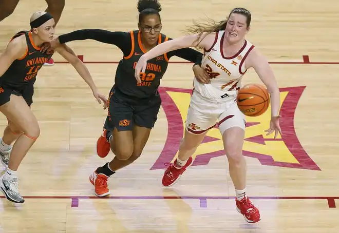 Iowa State Cyclones forward Addy Brown (24) and Oklahoma State Cowgirls guard Stailee Heard (32) and guard Rylee Langerman (11) battle for a loose ball during the third quarter in the Big-12 conference matchup at Hilton Coliseum on Wednesday, Jan. 31, 2024, in Ames, Iowa.