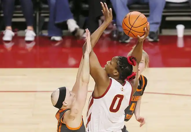 Iowa State Cyclones center Isnelle Natabou (0) takes a shot over Oklahoma State Cowgirls guard Rylee Langerman (11)during the third quarter in the Big-12 conference matchup at Hilton Coliseum on Wednesday, Jan. 31, 2024, in Ames, Iowa.