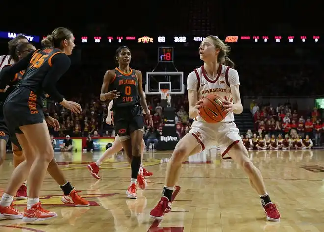 Iowa State Cyclones guard Emily Ryan (11) looks for a shpt around Oklahoma State Cowgirls guard Emilee Ebert (45)during the fourth quarter in the Big-12 conference matchup at Hilton Coliseum on Wednesday, Jan. 31, 2024, in Ames, Iowa.