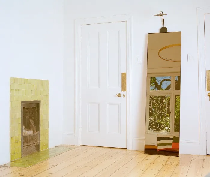 A mirror in one of the bedrooms in his house