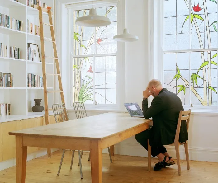 Hugo at his table by furniture maker Allan Lutge