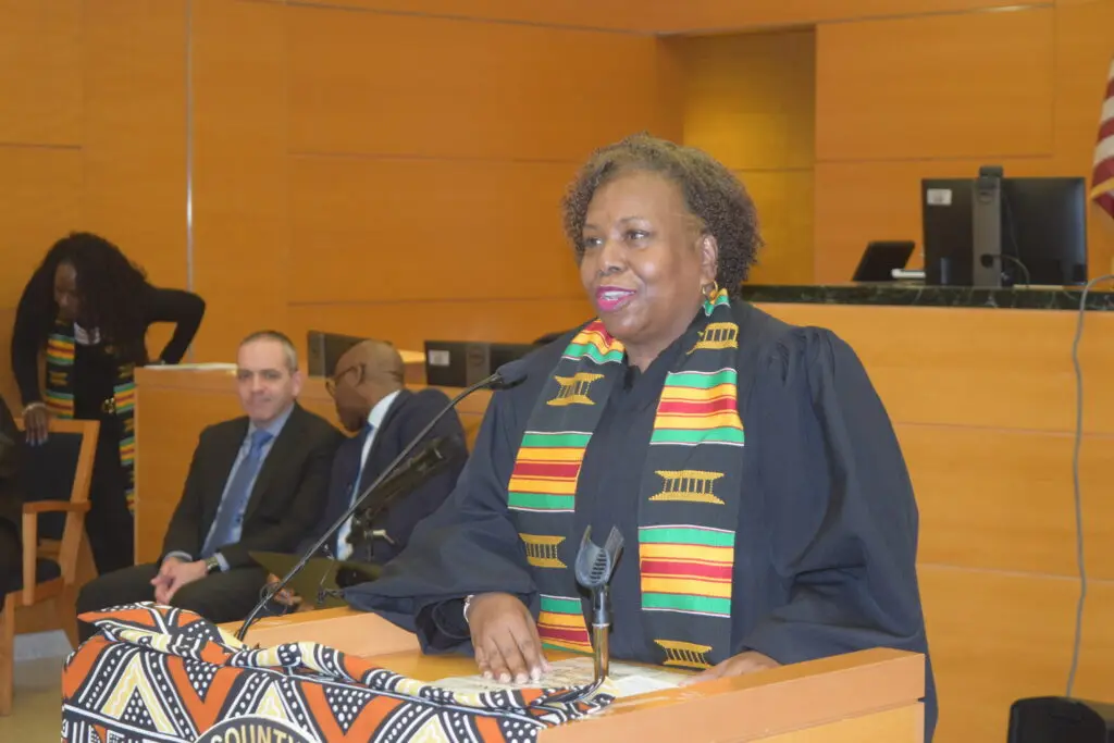 Justice Cenceria Edwards, president-elect of the Brooklyn Women's Bar Association, shares her insights during the ceremony.