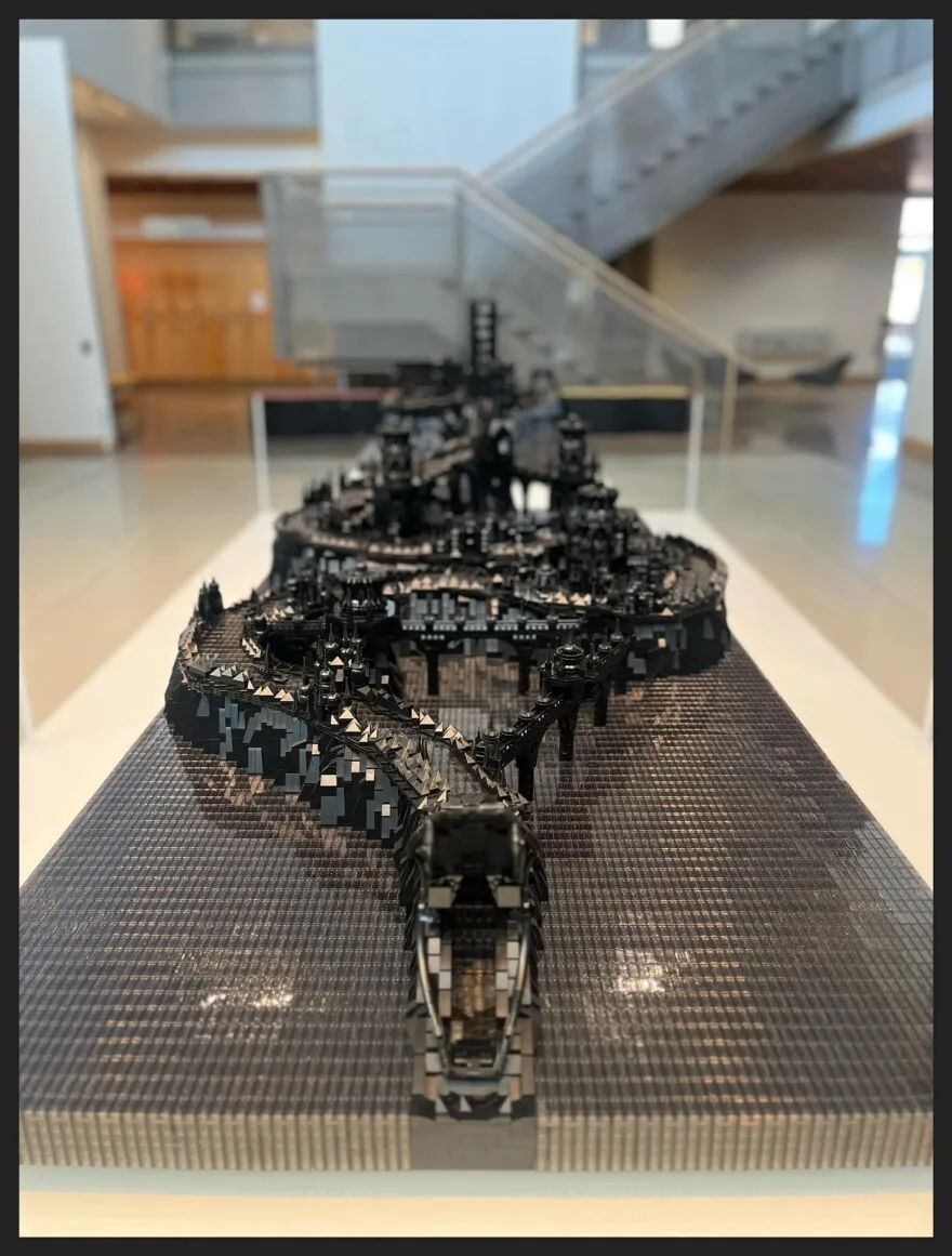 A black snake made entirely from Legos.