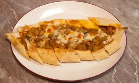 ‘A hot-crusted bready canoe’: aubergine pide.