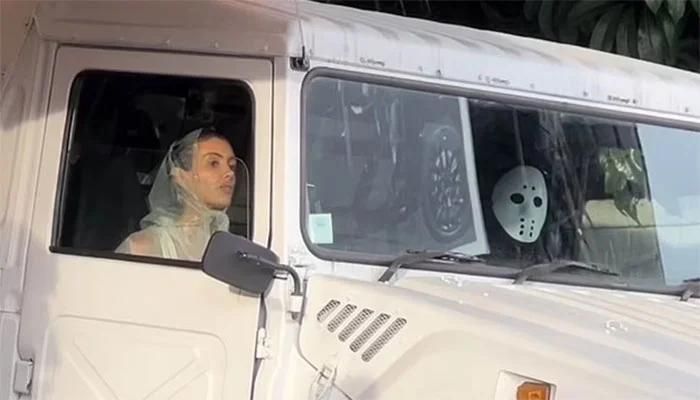 Kanye West Wears a Halloween Mask Alongside Bianca Censori and Others to Meet Travis Scott