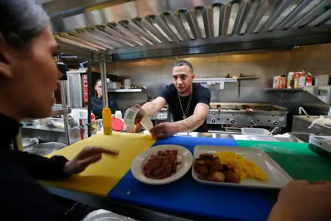 Jason Brooks reviews an order he is preparing at the new Toast n' Jam breakfast restaurant on Acushnet Avenue in New Bedford.